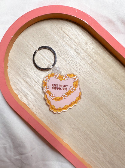 Have The Day You Deserve Cake Keychain