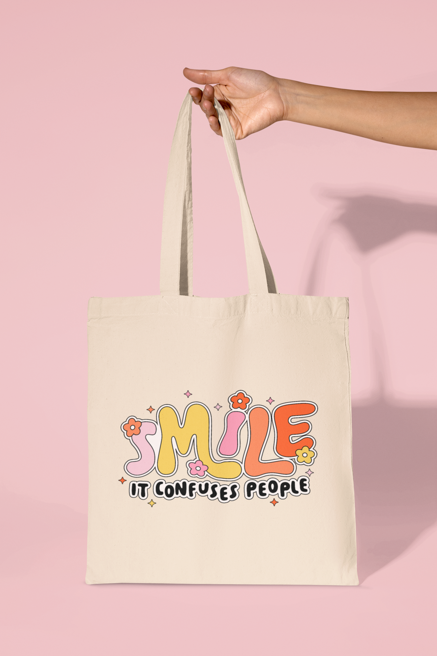 Smile It Confuses People Tote Bag