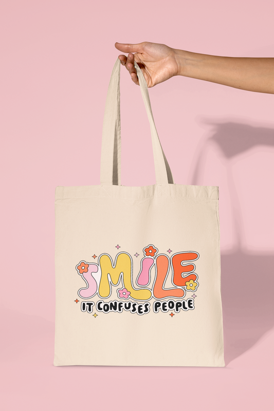 Smile It Confuses People Tote Bag