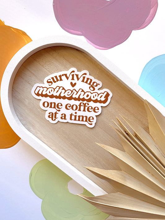 Surviving Motherhood One Coffee At A Time Sticker